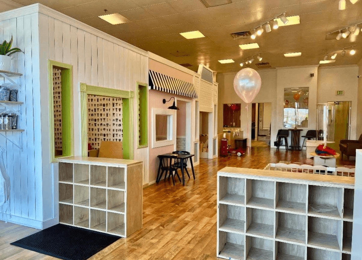 Bloom Play Lab indoor play space with themed playhouses and cubbies